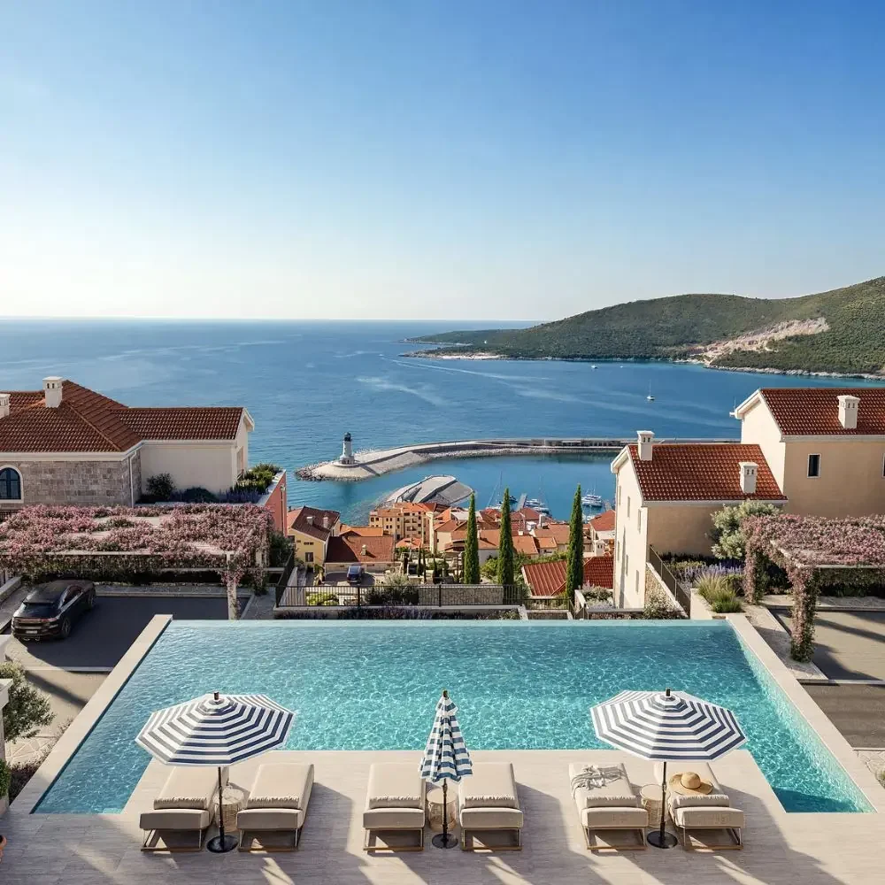 Pool with sun loungers above the marina